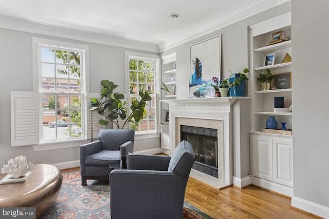 1206 N Pitt St, Alexandria, VA 22314 - sitting room with a fireplace, wood finished floors, crown molding, and built in features
