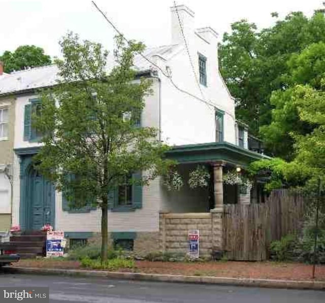 165 E Louther St, Carlisle, PA 17013 - view of property exterior with a chimney