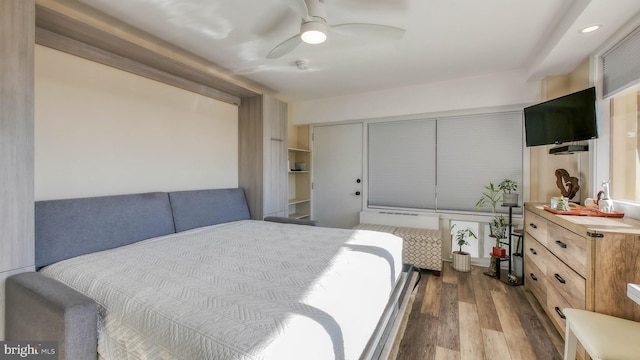 108 Montpelier Ave Unit 214, Atlantic City, NJ 08401 - bedroom featuring wood finished floors, a closet, a ceiling fan, and radiator