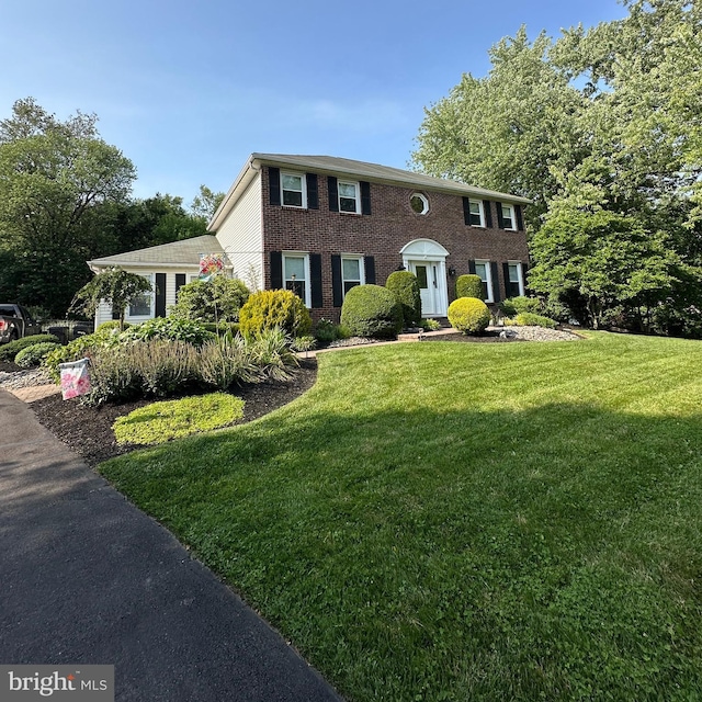 82 Blue Fox Ln, Richboro, PA 18954 - colonial house with a front yard and brick siding