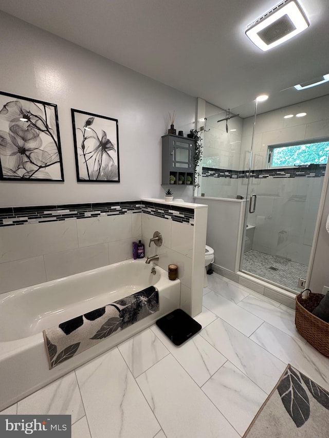 82 Blue Fox Ln, Richboro, PA 18954 - full bath featuring a garden tub, a stall shower, marble look tiles, and tile walls