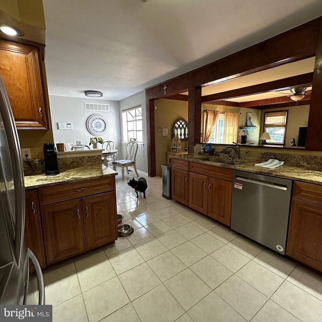 82 Blue Fox Ln, Richboro, PA 18954 - kitchen with dishwasher, freestanding refrigerator, ceiling fan, light tile patterned floors, and stone counters