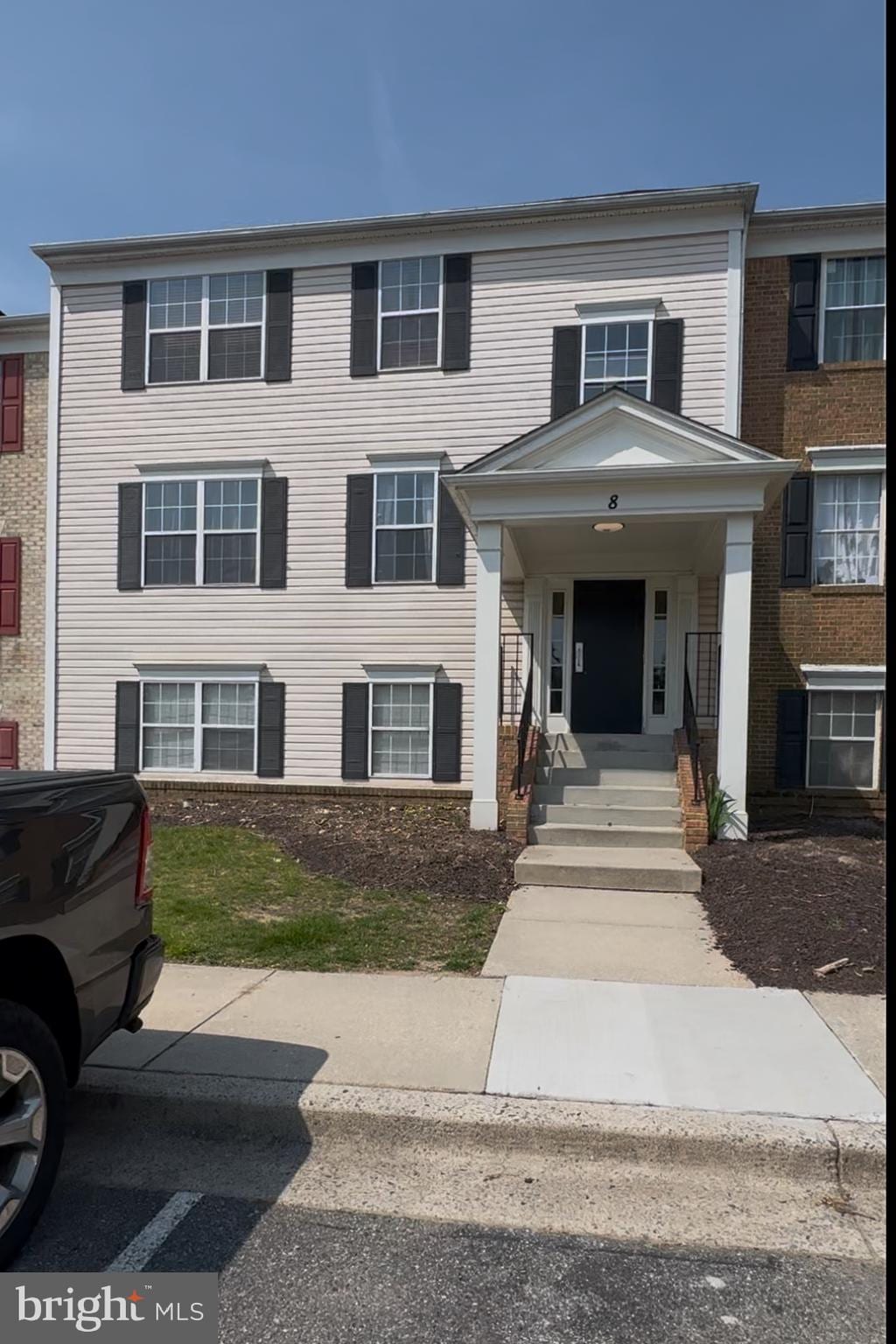 8 Normandy Square Ct Unit C, Silver Spring, MD 20906 - townhome / multi-family property featuring covered porch