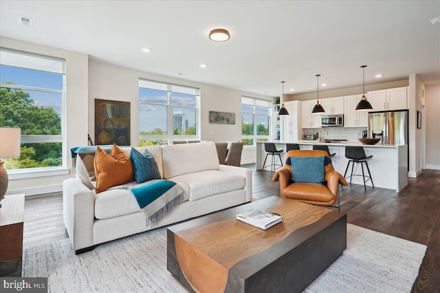 1761 Old Meadow Rd Unit 412, Mclean, VA 22102 - living room with recessed lighting and wood finished floors