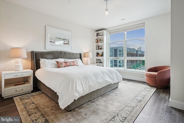 1761 Old Meadow Rd Unit 412, Mclean, VA 22102 - bedroom featuring wood finished floors and baseboards