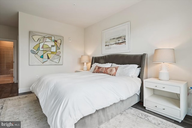 1761 Old Meadow Rd Unit 412, Mclean, VA 22102 - bedroom with wood finished floors and baseboards