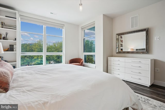 1761 Old Meadow Rd Unit 412, Mclean, VA 22102 - bedroom with dark wood-style floors and baseboards