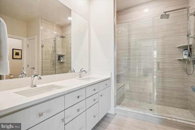 1761 Old Meadow Rd Unit 412, Mclean, VA 22102 - bathroom with double vanity and a shower stall