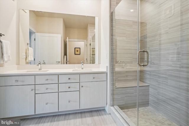 1761 Old Meadow Rd Unit 412, Mclean, VA 22102 - bathroom featuring double vanity and a stall shower