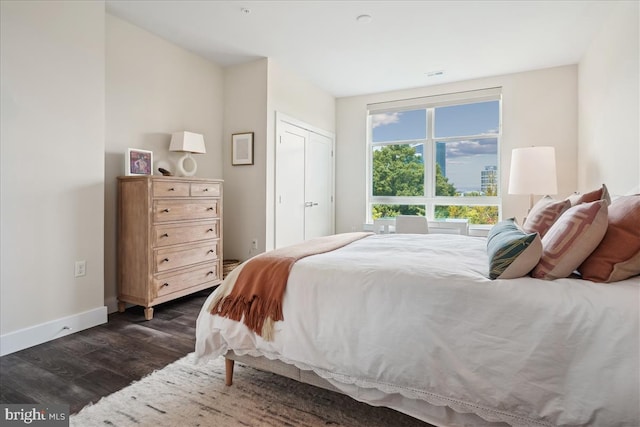 1761 Old Meadow Rd Unit 412, Mclean, VA 22102 - bedroom with dark wood-type flooring and baseboards