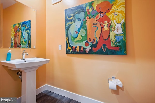 1761 Old Meadow Rd Unit 412, Mclean, VA 22102 - bathroom featuring baseboards and wood finished floors