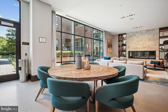 1761 Old Meadow Rd Unit 412, Mclean, VA 22102 - dining area featuring built in shelves and a wall of windows