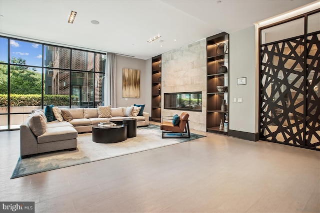 1761 Old Meadow Rd Unit 412, Mclean, VA 22102 - living room featuring built in features and a wall of windows