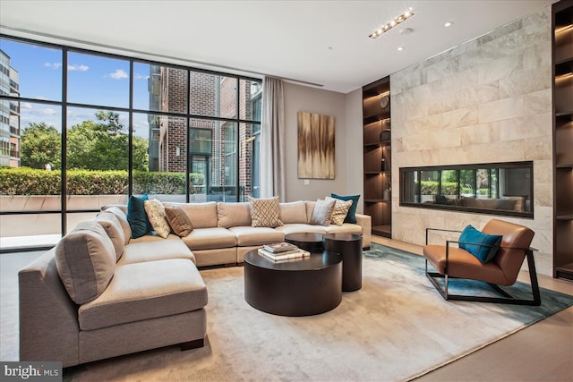 1761 Old Meadow Rd Unit 412, Mclean, VA 22102 - living room with built in shelves and a fireplace