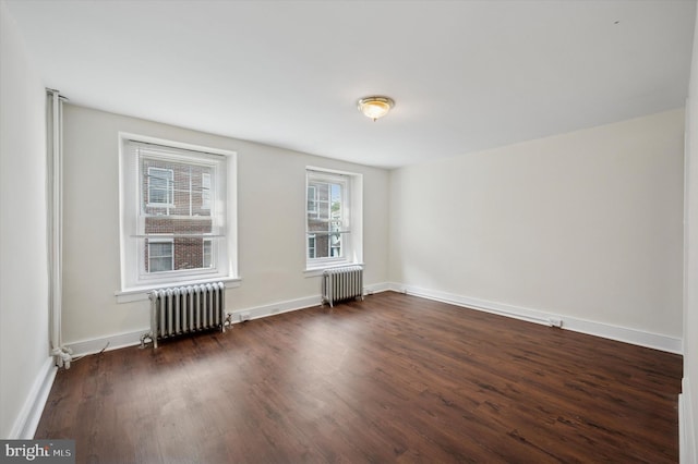 445 Dupont St, Philadelphia, PA 19128 - spare room featuring radiator and dark wood-style flooring