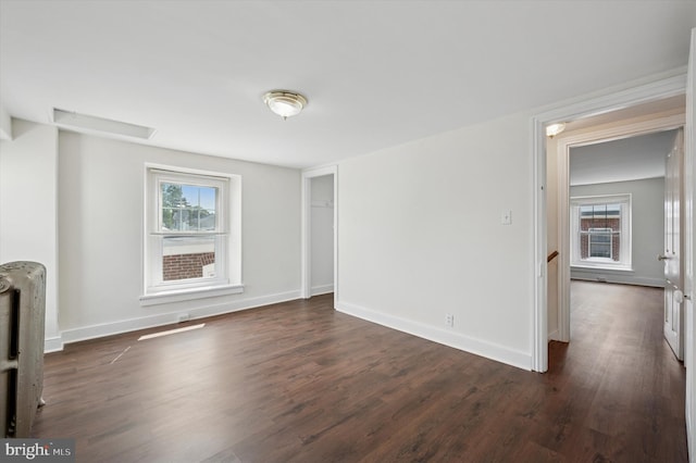 445 Dupont St, Philadelphia, PA 19128 - unfurnished living room featuring radiator and dark wood finished floors