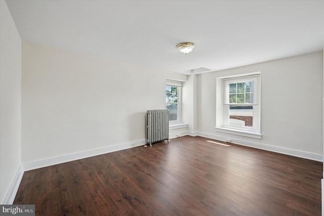 445 Dupont St, Philadelphia, PA 19128 - empty room featuring radiator heating unit and dark wood-style flooring
