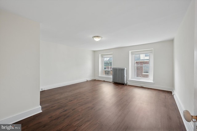 445 Dupont St, Philadelphia, PA 19128 - empty room with radiator and dark wood finished floors