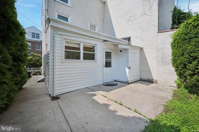 445 Dupont St, Philadelphia, PA 19128 - rear view of house featuring a patio area and stucco siding