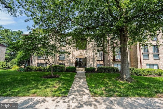 2074 Royal Fern Ct Unit 1C, Reston, VA 20191 - view of front of house featuring a front yard and brick siding