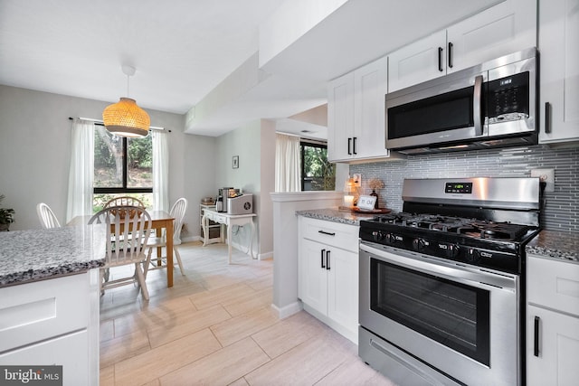 2074 Royal Fern Ct Unit 1C, Reston, VA 20191 - kitchen with appliances with stainless steel finishes, tasteful backsplash, and light stone countertops