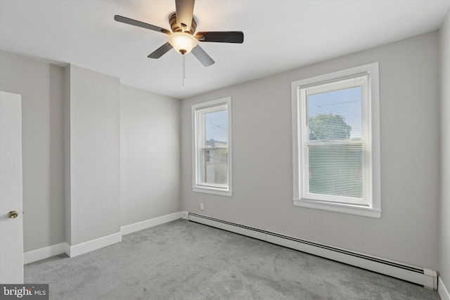 3121 Edgemont St, Philadelphia, PA 19134 - spare room featuring baseboard heating, carpet floors, and a ceiling fan