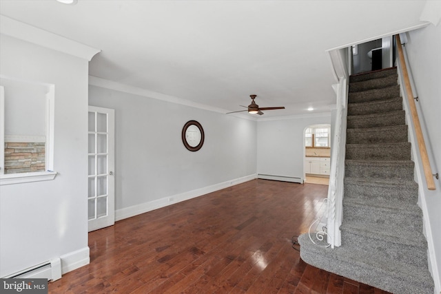 3121 Edgemont St, Philadelphia, PA 19134 - unfurnished living room featuring a baseboard radiator, a ceiling fan, stairs, ornamental molding, and wood finished floors
