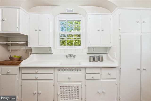 4420 Brandywine St NW, Washington, DC 20016 - kitchen with white cabinets and light countertops