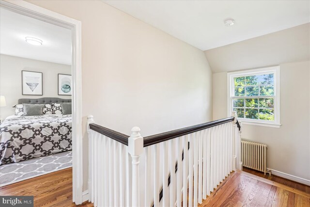 4420 Brandywine St NW, Washington, DC 20016 - stairway with radiator heating unit, wood finished floors, and lofted ceiling