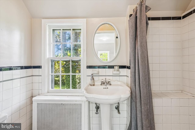 4420 Brandywine St NW, Washington, DC 20016 - full bath featuring radiator heating unit, plenty of natural light, and tile walls