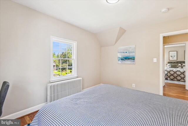 4420 Brandywine St NW, Washington, DC 20016 - bedroom featuring radiator heating unit and wood finished floors