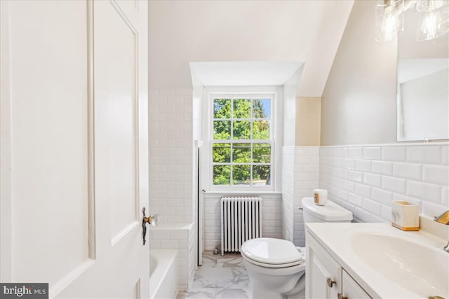 4420 Brandywine St NW, Washington, DC 20016 - bathroom featuring radiator, vanity, marble finish flooring, tile walls, and a wainscoted wall