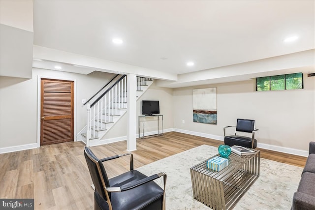 4420 Brandywine St NW, Washington, DC 20016 - living room with wood finished floors, stairway, and recessed lighting