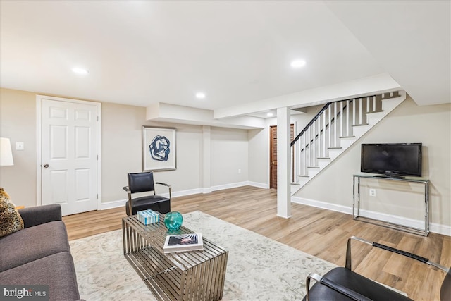 4420 Brandywine St NW, Washington, DC 20016 - living room with wood finished floors, stairs, and recessed lighting