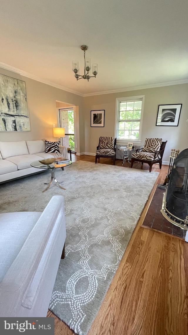 4420 Brandywine St NW, Washington, DC 20016 - living room featuring crown molding, a chandelier, and plenty of natural light