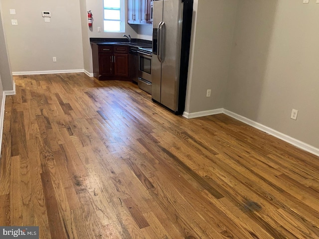 2108 N 17th St, Philadelphia, PA 19121 - kitchen with stainless steel appliances, dark countertops, and wood finished floors
