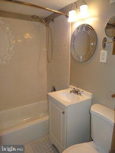 3901 Tunlaw Rd NW Unit 202, Washington, DC 20007 - full bathroom with bathtub / shower combination and vanity