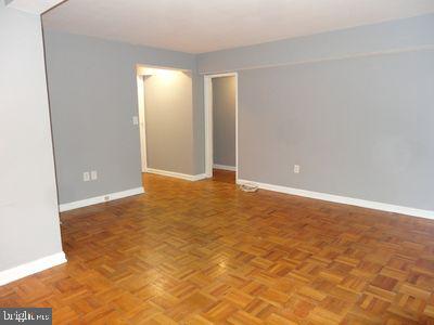 3901 Tunlaw Rd NW Unit 202, Washington, DC 20007 - empty room with baseboards