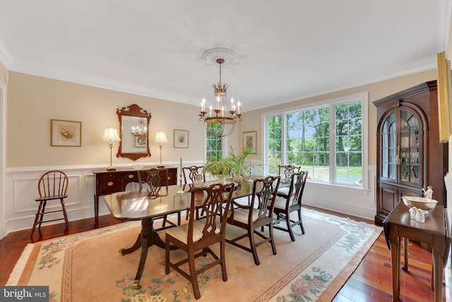 650 S Warren Ave, Malvern, PA 19355 - dining room featuring crown molding, light wood-type flooring, a chandelier, and wainscoting