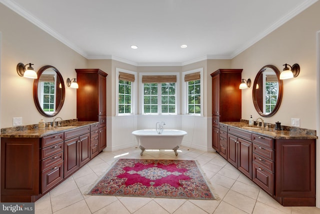 650 S Warren Ave, Malvern, PA 19355 - full bath featuring two vanities, a soaking tub, tile patterned flooring, ornamental molding, and a wainscoted wall