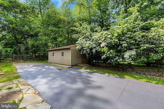 650 S Warren Ave, Malvern, PA 19355 - view of patio with asphalt driveway and a storage unit