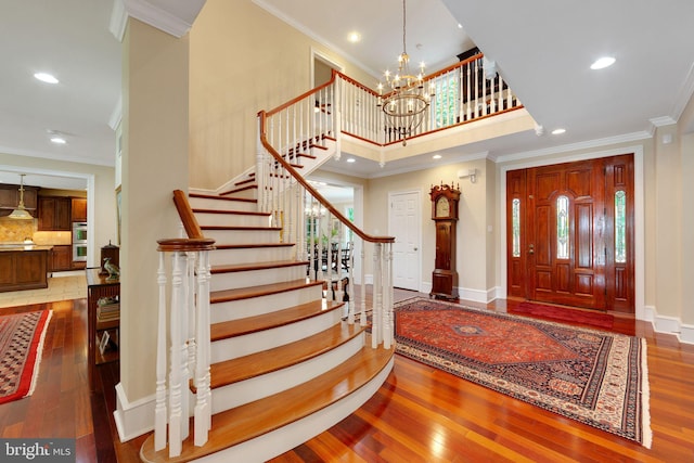 650 S Warren Ave, Malvern, PA 19355 - entrance foyer with wood-type flooring, stairs, recessed lighting, plenty of natural light, and ornamental molding
