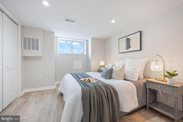19 N Smallwood St, Baltimore, MD 21223 - bedroom with light wood finished floors and recessed lighting