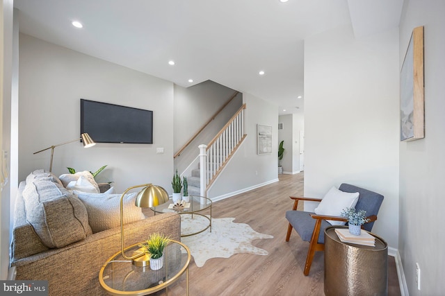 19 N Smallwood St, Baltimore, MD 21223 - living room featuring stairway, wood finished floors, and recessed lighting
