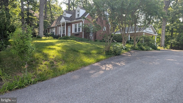 1903 Kirby Rd, Mclean, VA 22101 - cape cod-style house featuring brick siding, a front yard, and asphalt driveway