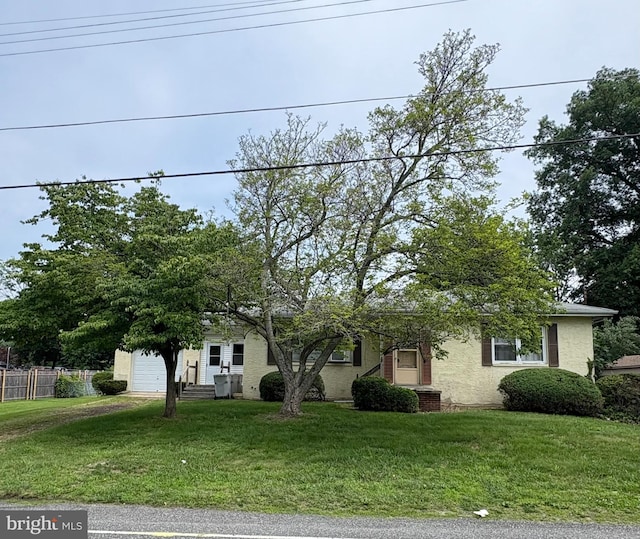 66 W Walnut Rd, Vineland, NJ 08360 - view of property hidden behind natural elements with a garage, entry steps, and driveway