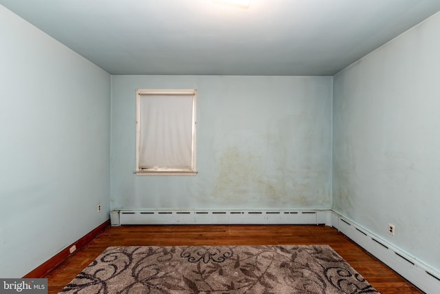 66 W Walnut Rd, Vineland, NJ 08360 - spare room with wood finished floors, baseboard heating, and a baseboard radiator