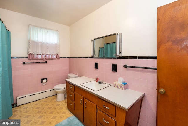 66 W Walnut Rd, Vineland, NJ 08360 - bathroom with a baseboard heating unit, tile walls, vanity, a wainscoted wall, and a shower with curtain