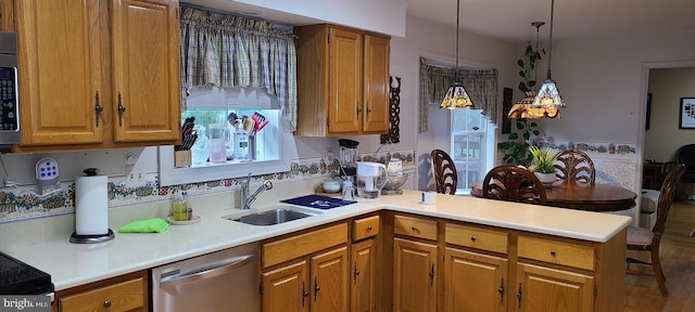 13209 Marthas Choice Cir, Bowie, MD 20720 - kitchen featuring stainless steel appliances, a peninsula, light countertops, and brown cabinets