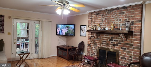 13209 Marthas Choice Cir, Bowie, MD 20720 - living room with wood finished floors, ornamental molding, ceiling fan, and a brick fireplace